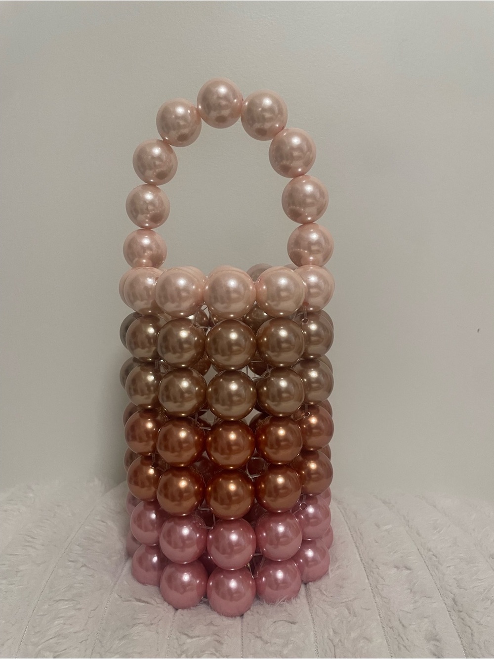 Vanina handcrafted glossy pearl pink/taupe top handle cylinder bag